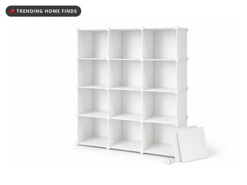 White twelve-cube modular closet storage organizer with spare panels, on a white background