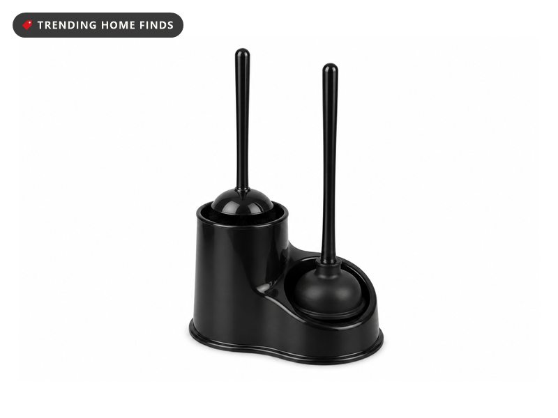 Glossy black caddy with two wells holding a toilet brush upright in one and a black rubber plunger in the other, both handles matching.