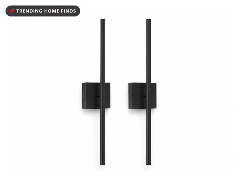 Pair of slim matte black battery powered wall sconces with rotating light tubes on square backplates