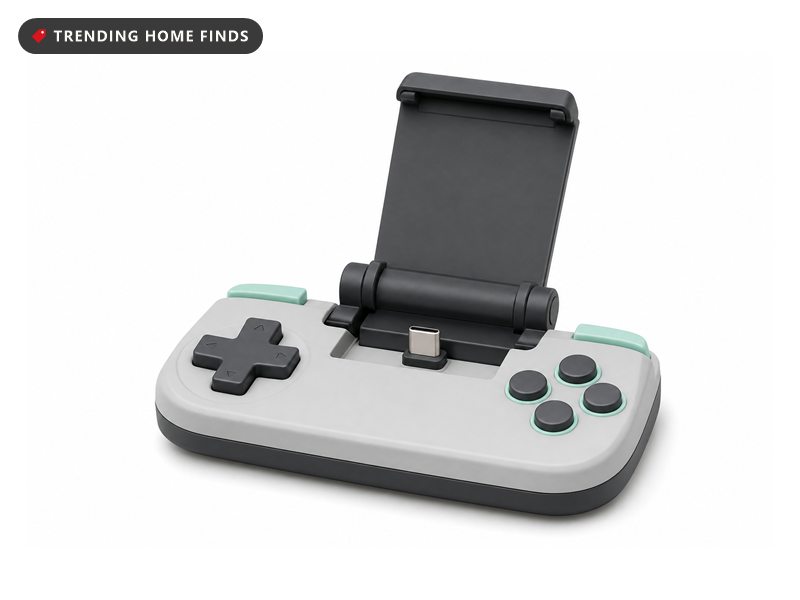 Small grey clip-on mobile gaming button pad, on a white background