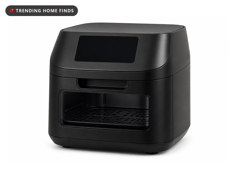 A black air fryer on a dark kitchen counter late at night, its lit window showing chicken wings inside and its screen glowing softly.
