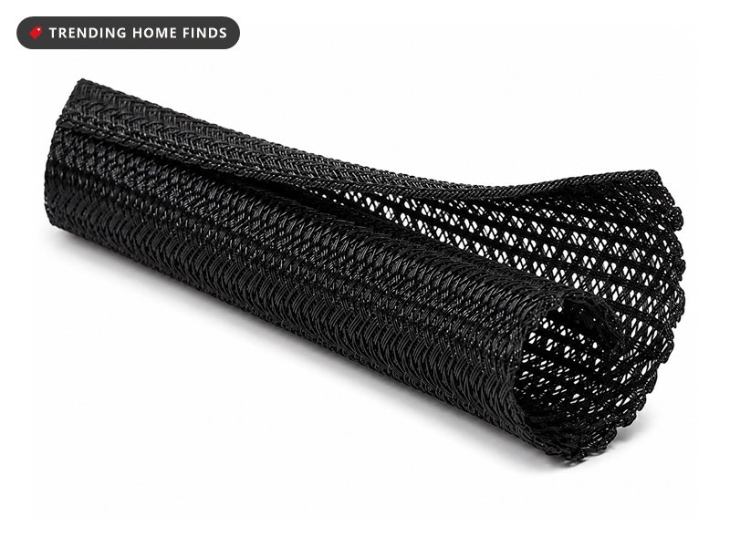 Roll of black braided split wire loom sleeving with the lengthwise split seam open along the near end