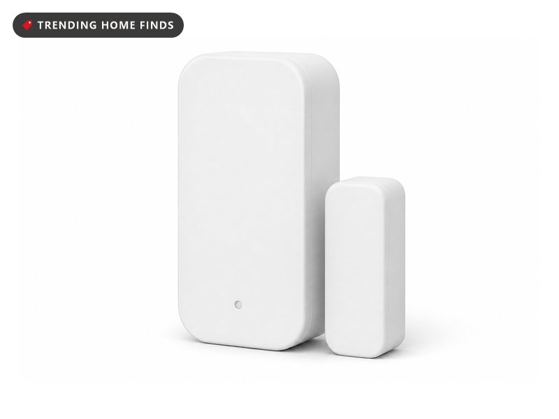 Two plain white rounded plastic blocks, one larger with a small recessed dot, mounted as a pair.