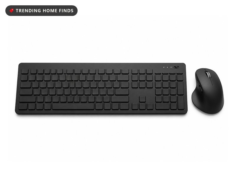 Full-size black wireless keyboard with a number pad beside a black ergonomic mouse, on a white background