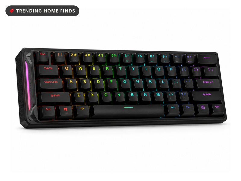 Compact black gaming keyboard with rainbow RGB backlighting between black keycaps and a glowing side strip