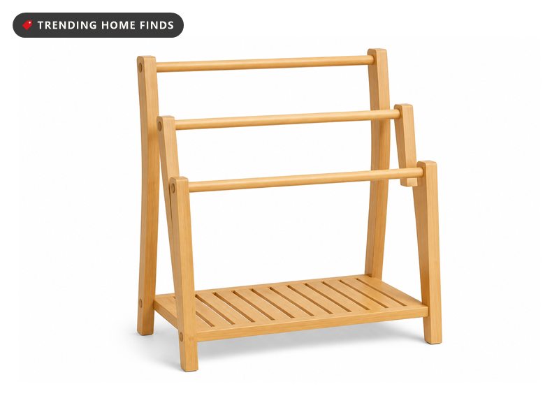 A natural bamboo towel rack with three staggered hanging rails and a slatted bottom shelf.