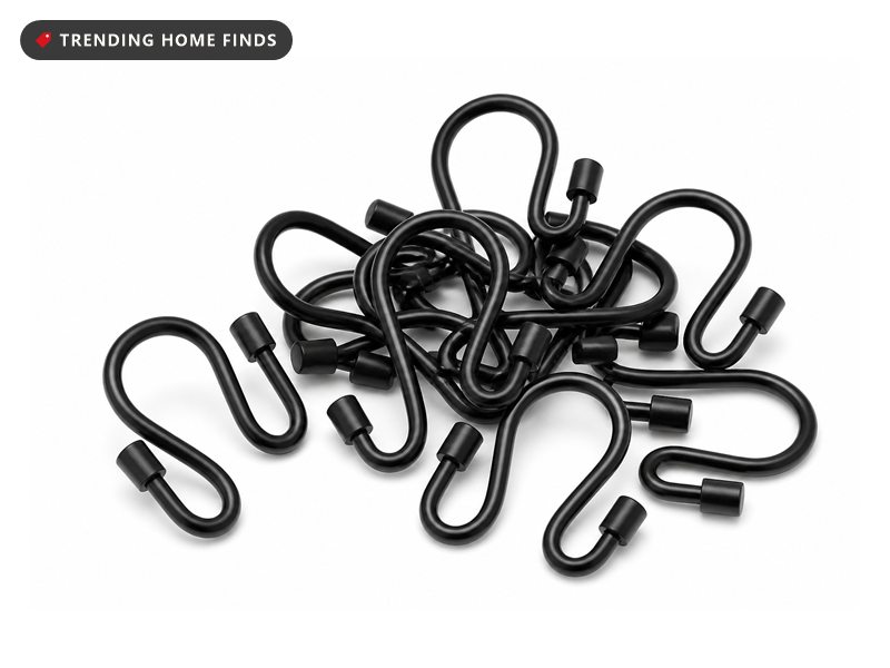 Matte black metal double shower curtain hooks with small cylindrical end caps, hooked over a rail.