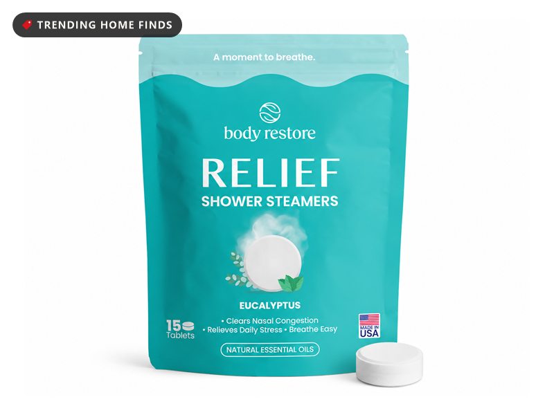 Teal Body Restore Relief shower steamers bag with a white eucalyptus tablet in front