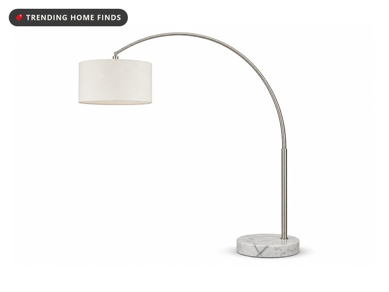 Tall arc floor lamp with a hanging drum shade and a round marble base, shown on a white background.