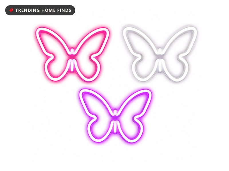 Three butterfly-shaped neon wall lights with open wings, one glowing hot pink, one white and one purple, each formed from a single outlined tube