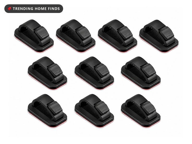 Ten black adhesive cable clips arranged in rows, each with a red adhesive backing pad and an adjustable strap across the top