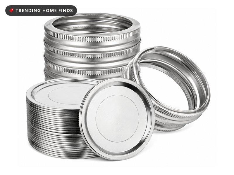 Stack of silver regular mouth canning lids beside a stack of metal screw rings