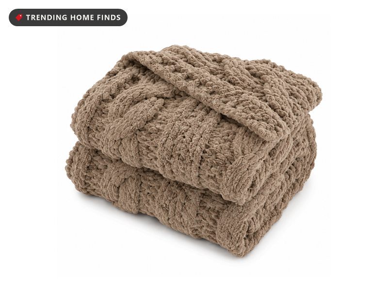 Folded tan chunky knit throw blanket
