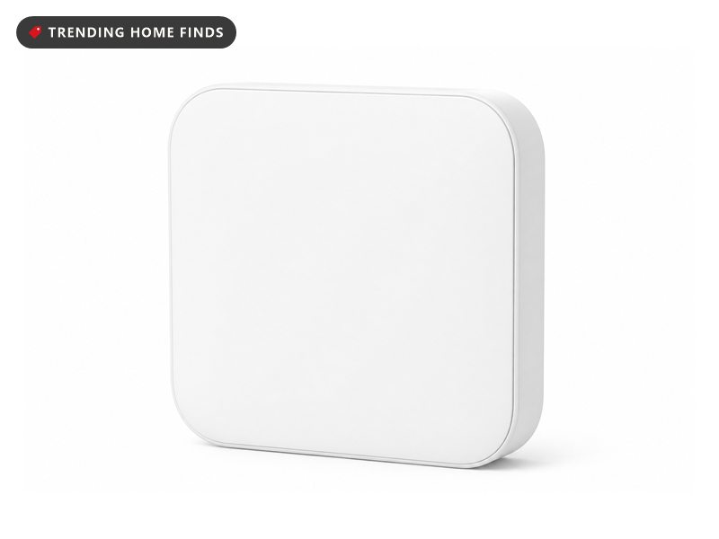 Small white smart air conditioner controller with a plain rounded face, shown on a white background.