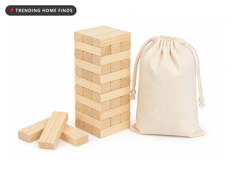 A tower of plain wooden blocks beside a cream cloth drawstring bag.
