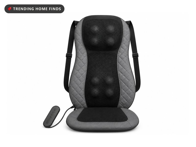 Grey and black shiatsu massage chair pad with a raised neck module, mesh back panel, padded side wings and a wired controller.