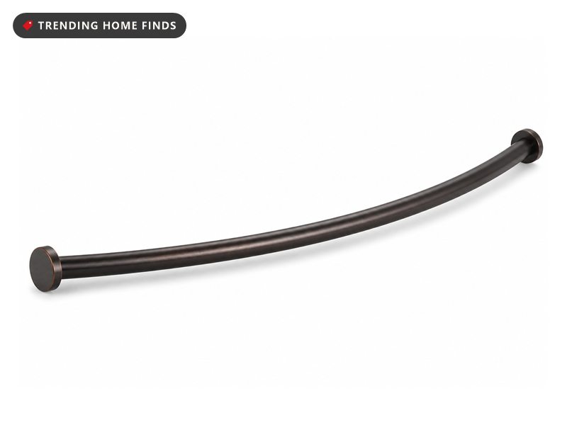 A curved bronze shower curtain rod with round end caps.