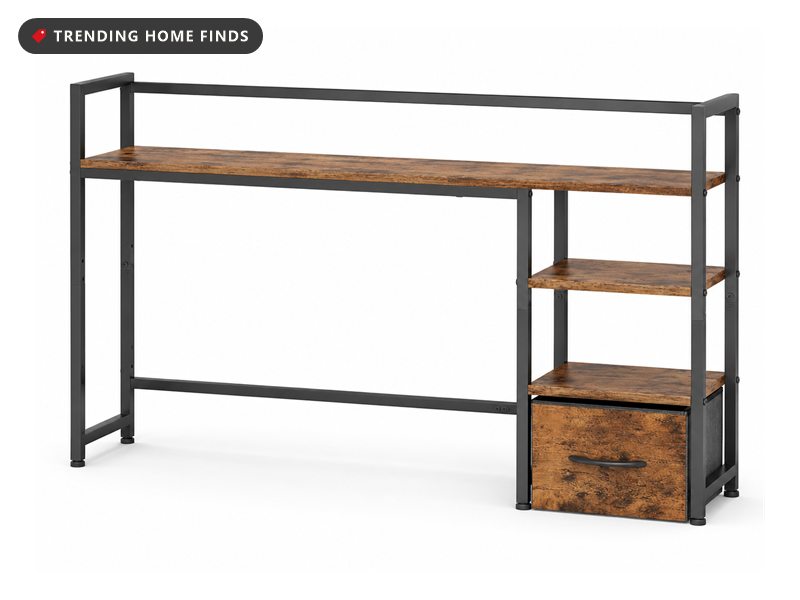Long rustic brown desk shelf on a black metal frame with a two-tier tower and a fabric drawer at one end, on a white background