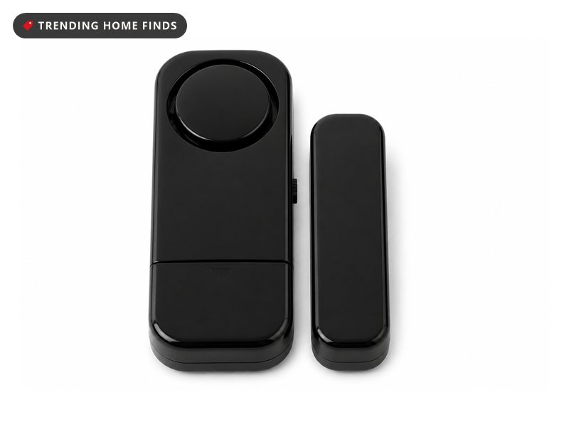 Two part black plastic entry alarms, a bar with a round speaker dome and a plain matching magnet bar.