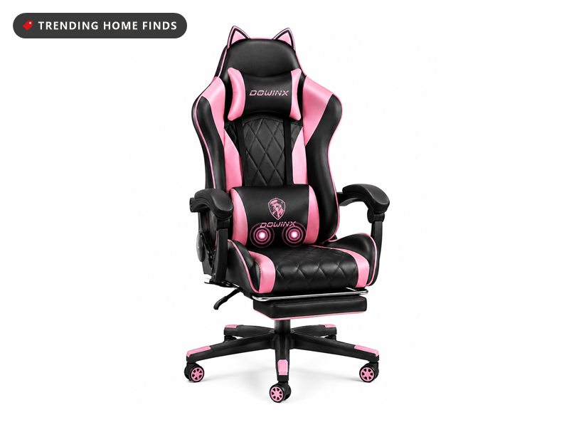 Black and pink gaming chair with cat ears on the headrest, diamond stitched seat and backrest, a separate lumbar pillow, padded armrests and a footrest extended underneath