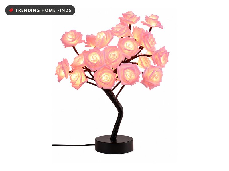 Tabletop tree lamp with glowing pink rose flowers on a black base