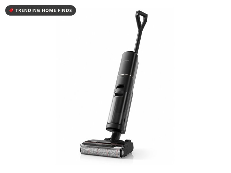 Black DREAME Aero Pro cordless wet dry vacuum mop standing upright, with a clear water tank and a textured cleaning roller in the floor head