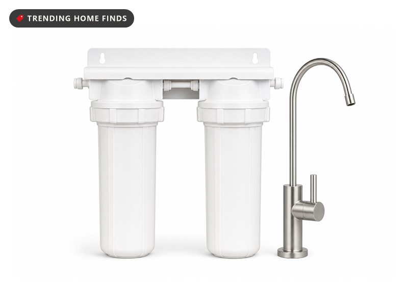 Two-stage under-sink water filtration system with white housings and a brushed nickel tap, on a white background