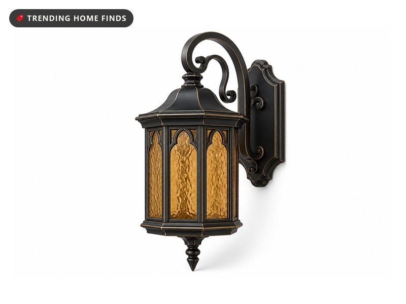 Tall black and bronze six-sided outdoor lantern with rippled amber glass panels and a scrolled mounting arm.