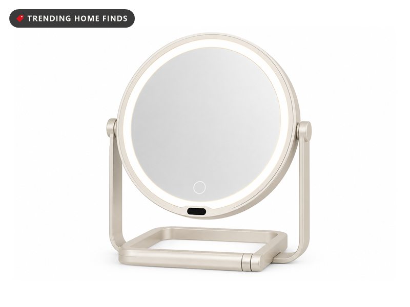 Round cream double sided makeup mirror with a ring light around the glass, standing on a folding loop stand.