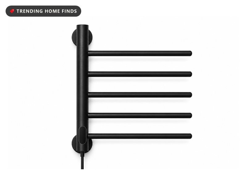 Black wall-mounted heated towel rack with five swivel bars and a digital temperature display on the control column