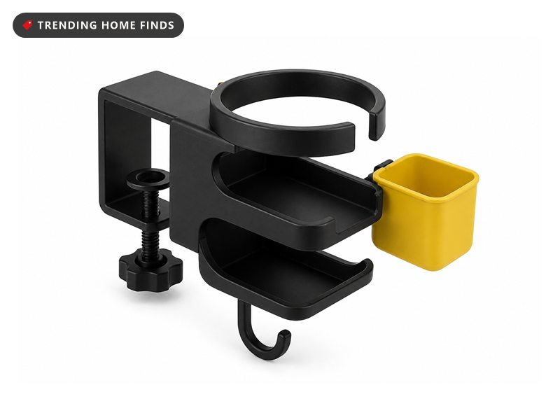 A matte black clamp on desk organizer with a drink ring, two controller cradles, a headphone hook and a yellow snack tub.
