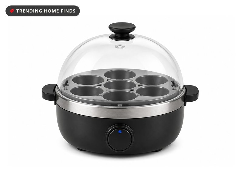 Black Evoloop electric egg cooker with a clear domed lid over six eggs and a soft, medium and hard setting dial on the base