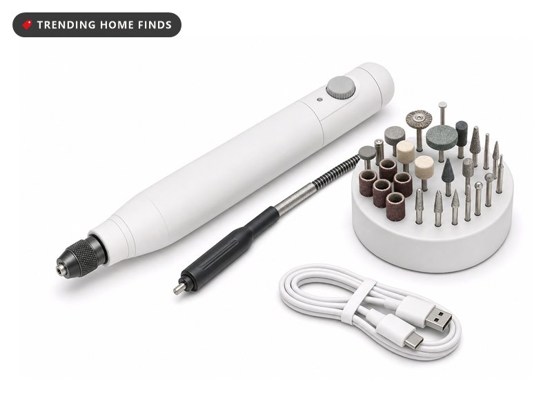 Slim white cordless rotary tool with flex shaft and a stand of bits, on a white background