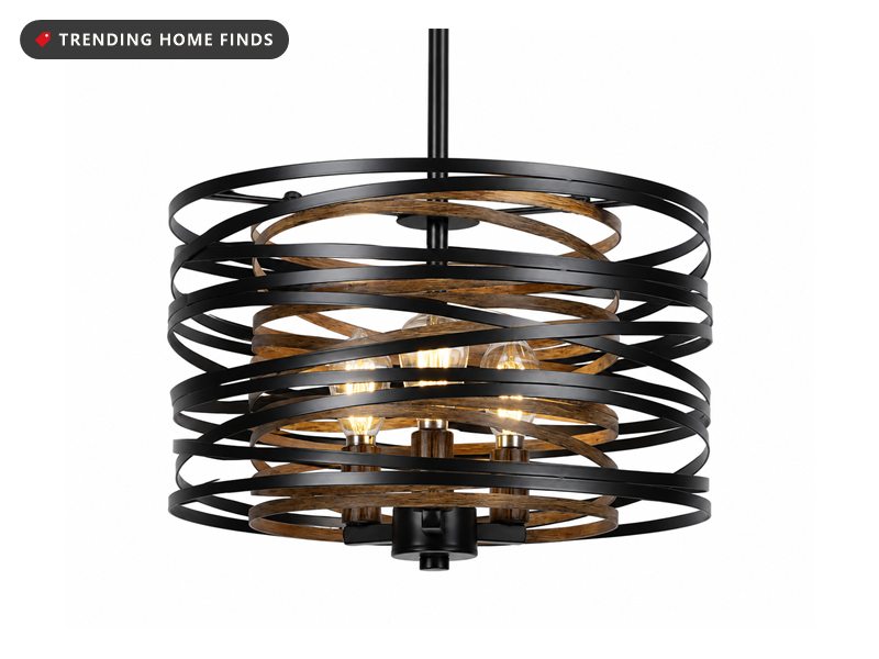 Black spiral metal drum chandelier with wood-tone rings and glowing bulbs inside