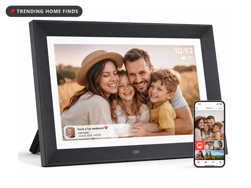 Black 10.1 inch WiFi digital picture frame displaying a family photo, shown beside a phone running the companion app