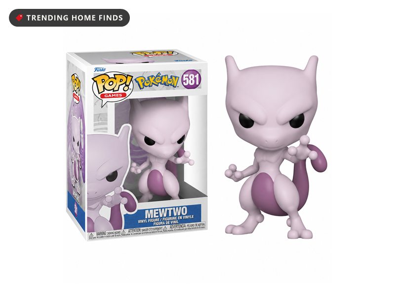 Funko Pop Pokemon Mewtwo vinyl figure number 581 standing beside its window box, a pale purple creature with a long curled tail in a crouched pose