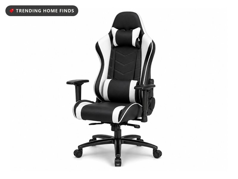 Black and white gaming chair with a high back, headrest pillow, lumbar cushion, padded armrests and a five wheel base