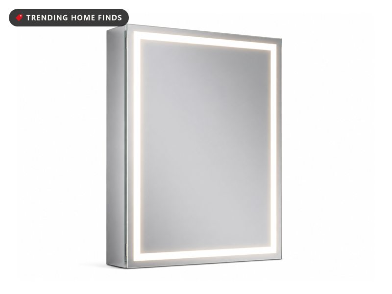 Aluminum LED bathroom mirror cabinet shown at an angle, with a lit warm white border running around the mirrored door