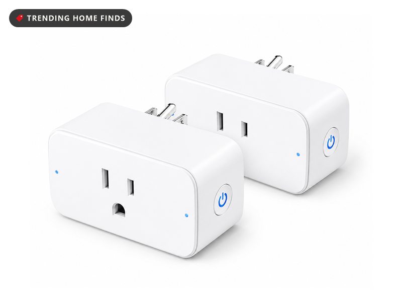 Two white GHome smart plugs with a pass-through outlet on the front and a small blue status light