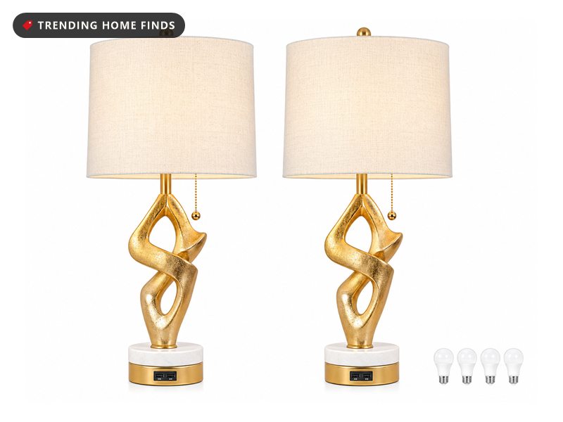 Pair of gold sculptural table lamps with white drum shades and included bulbs