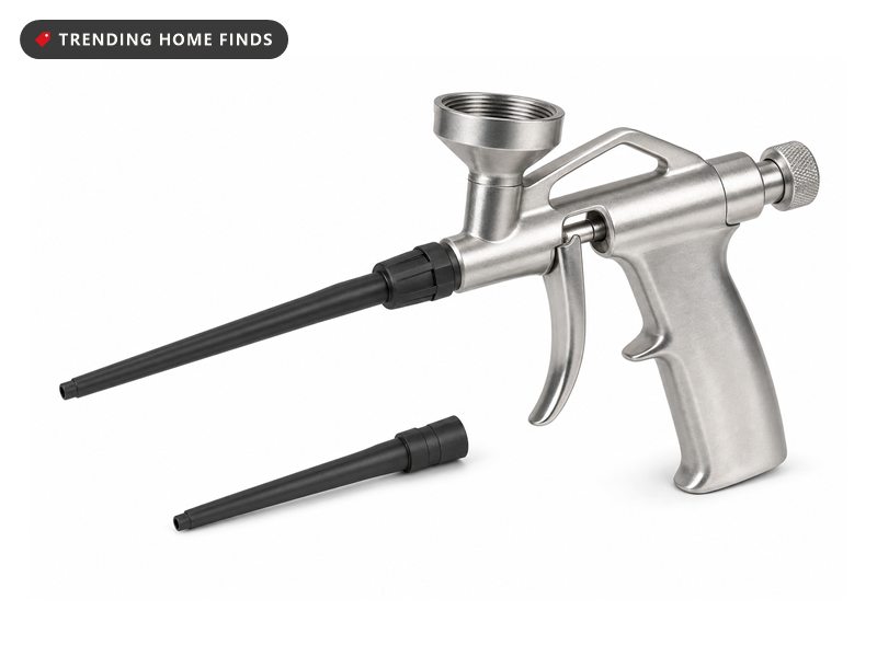 Aluminum spray foam dispensing gun with spare nozzles, on a white background