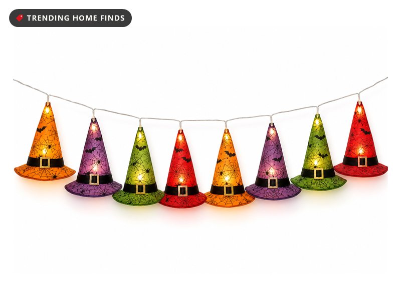 String of fabric witch hats in orange, purple and green glowing from lights inside each hat
