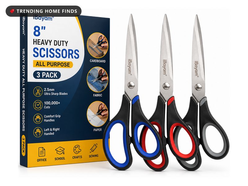 Three pairs of iBayam heavy duty scissors with red, blue and black comfort grip handles, beside the retail box
