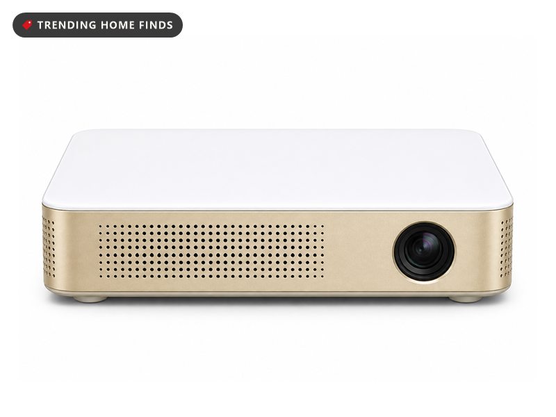 KODAK Luma 350 portable smart projector in cream and gold with a front lens and control buttons on top