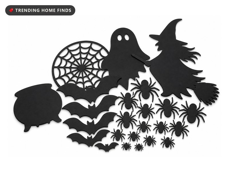 Flat matte black witch, bat, spider, web and ghost decals laid out overlapping in a loose fan.