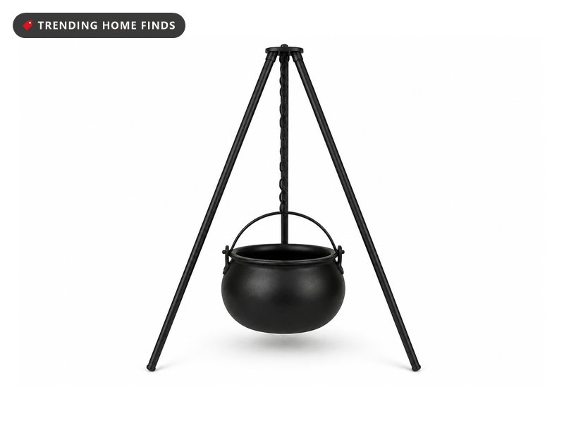 Black plastic cauldron hanging on a short chain from a tall three legged black aluminum tripod.