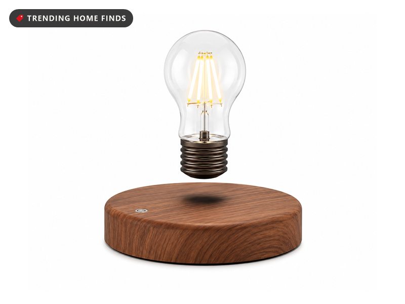 LED filament bulb floating above a round wood-look base