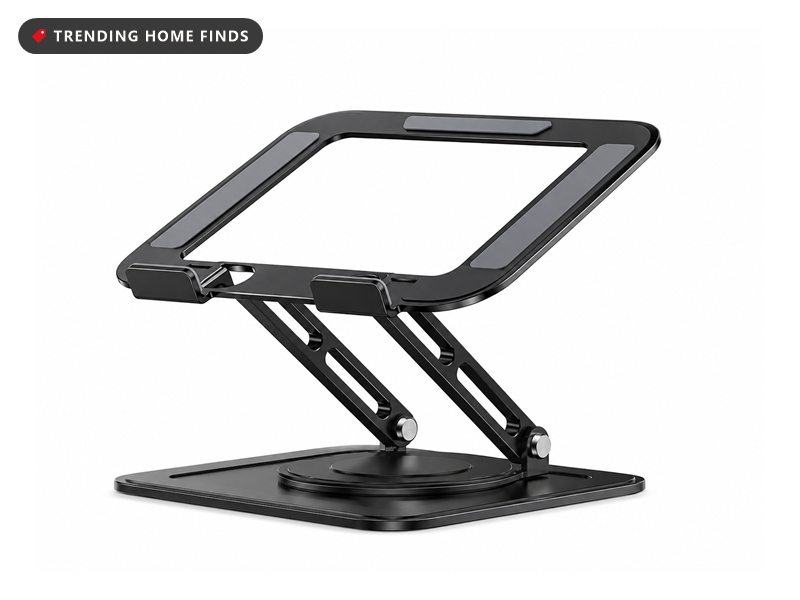 Black aluminum laptop stand with an open frame, folding slotted legs and a round rotating base, on a white background