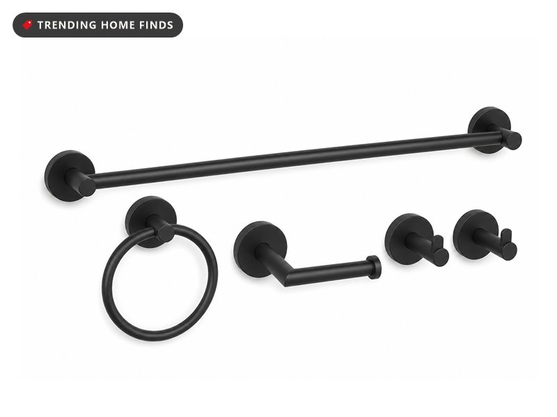 Matte black bathroom hardware set with towel bar, towel ring and robe hooks, on a white background
