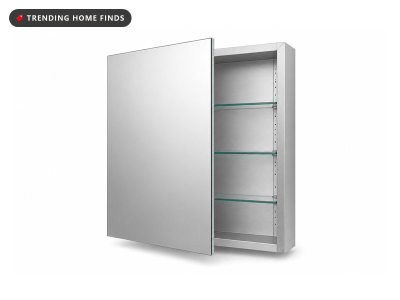 Recessed bathroom medicine cabinet with a mirrored door, on a white background